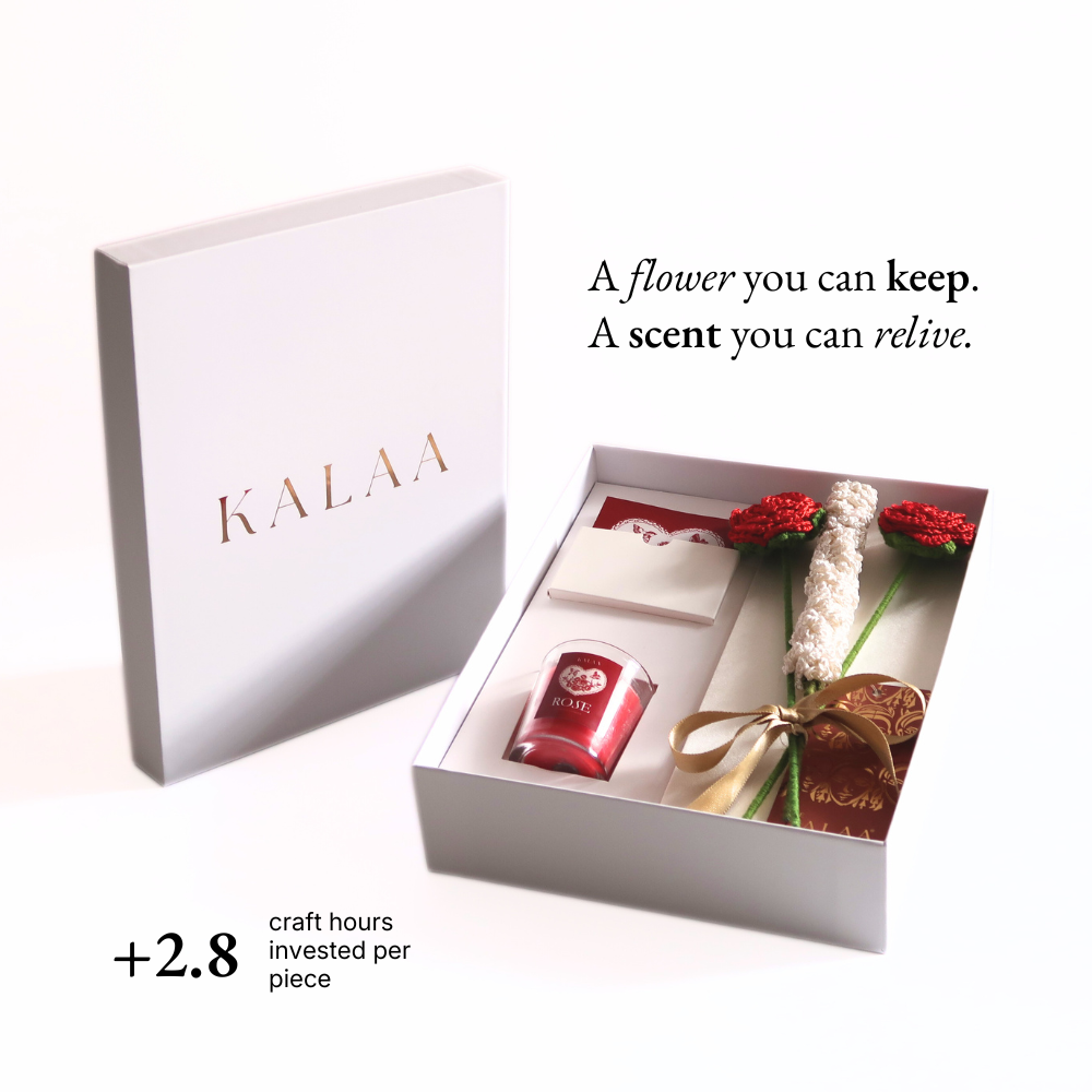 Gift set with a candle and flowers in a white box, featuring the brand 'KALAA'.