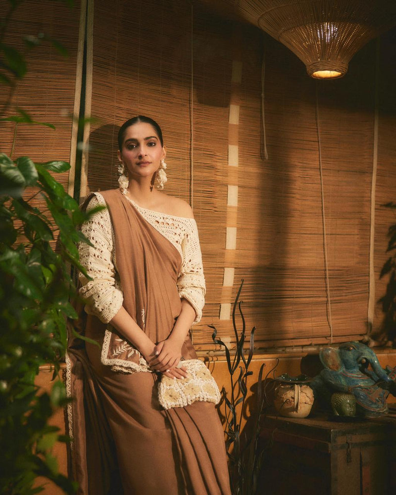 Sonam Kapoor carrying handwoven clutch by The Kalaa Store